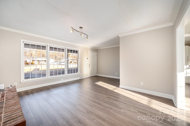 unfurnished living room featuring hardwood / wood-style flooring and ornamental molding