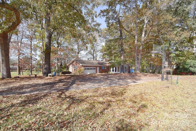 view of yard featuring a garage