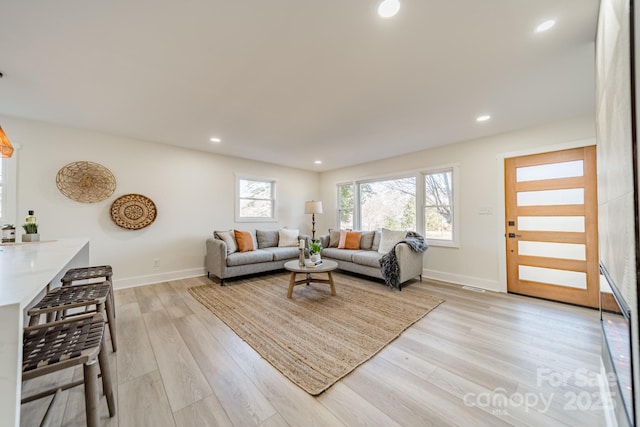 living room with light hardwood / wood-style floors