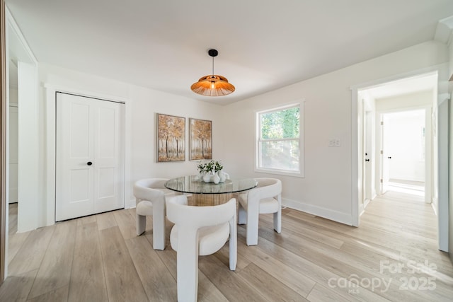 dining area featuring light wood-type flooring