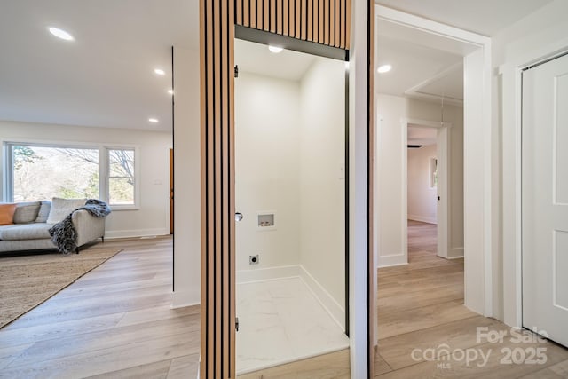 corridor featuring light hardwood / wood-style flooring