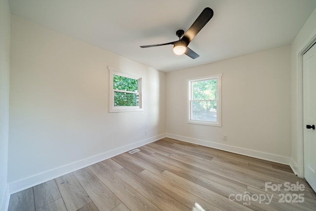 spare room featuring ceiling fan and light hardwood / wood-style flooring