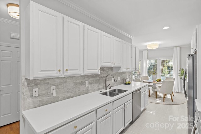 kitchen featuring sink and white cabinets