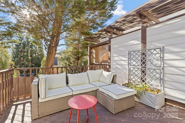 wooden deck with an outdoor living space