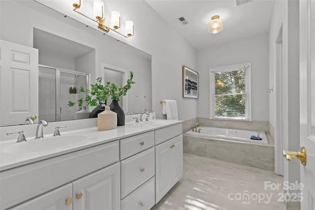 bathroom featuring tile patterned floors, vanity, and plus walk in shower