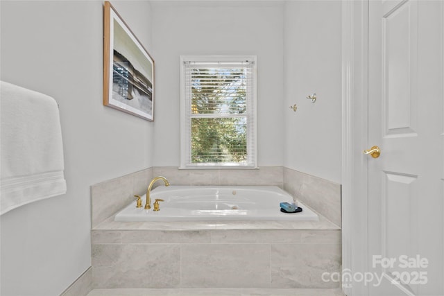 bathroom with tiled bath