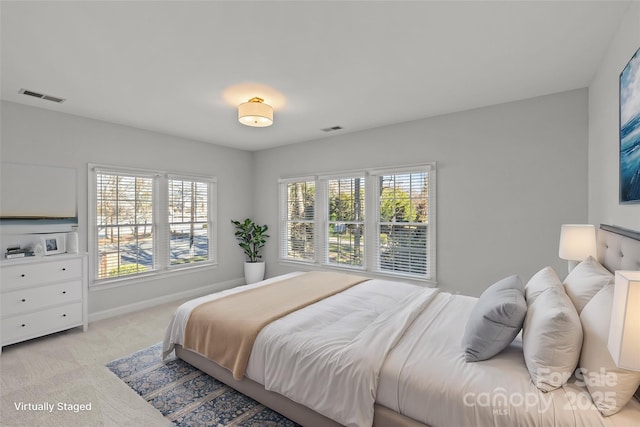 bedroom with light colored carpet