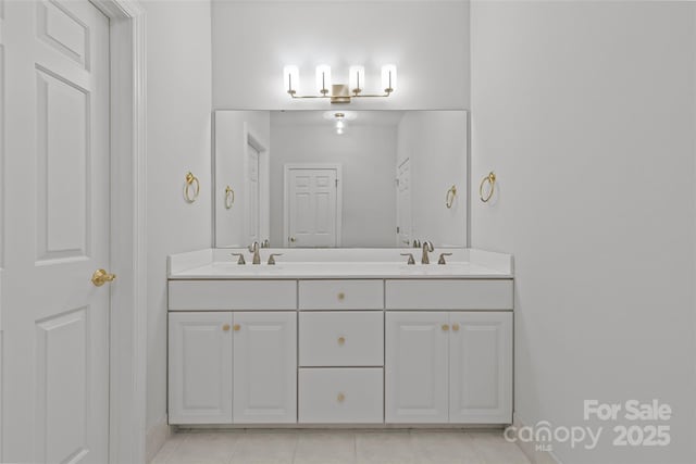 bathroom with tile patterned flooring and vanity