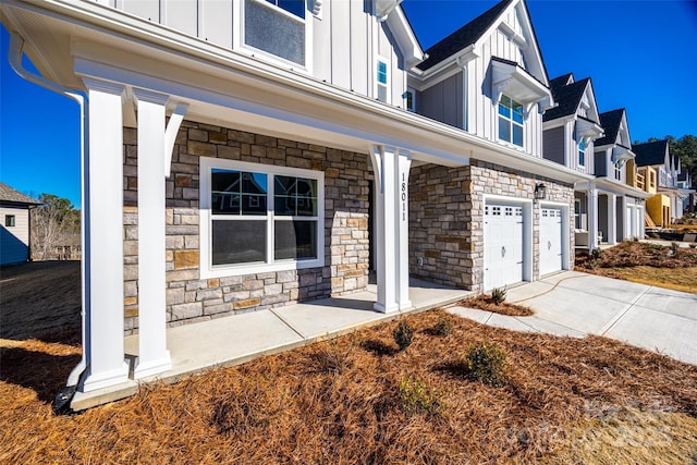 view of front facade with a porch and a garage