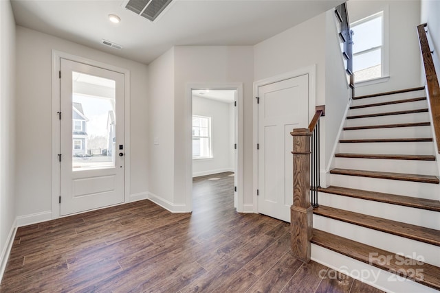 foyer with dark hardwood / wood-style floors