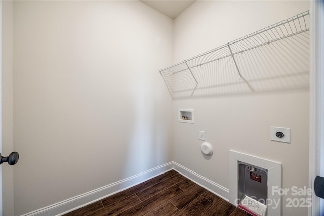 clothes washing area featuring hookup for an electric dryer, laundry area, washer hookup, dark wood-style flooring, and baseboards