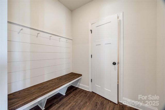 mudroom featuring dark wood-style floors and baseboards