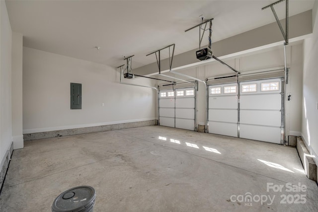 garage with a garage door opener and electric panel