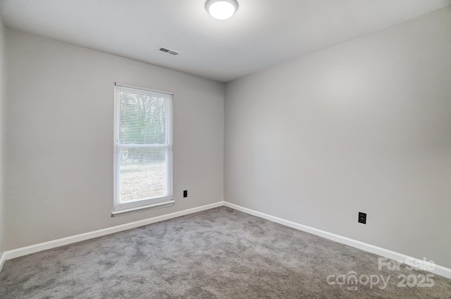 empty room with carpet flooring