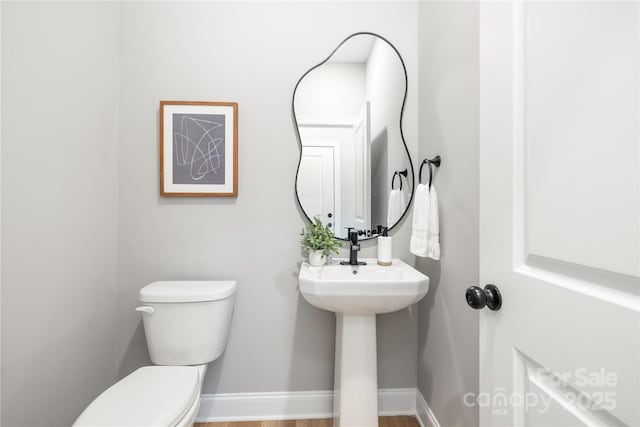 bathroom with sink and toilet