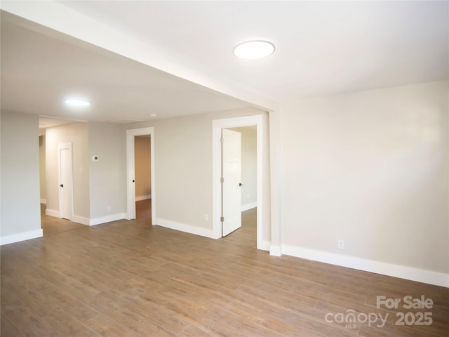 unfurnished room with light hardwood / wood-style flooring