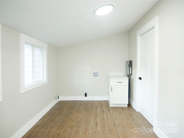 laundry room with light hardwood / wood-style floors, cabinets, and hookup for a washing machine