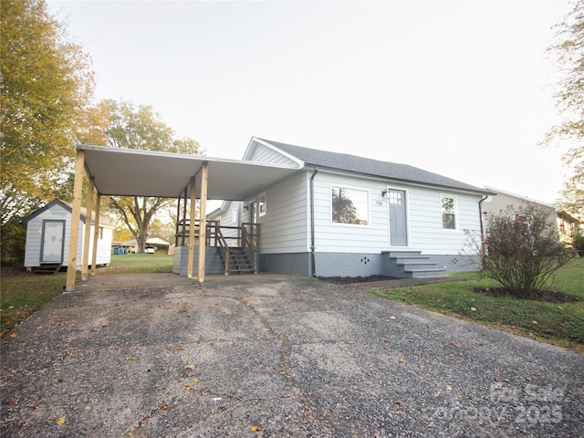 view of front of house featuring a storage unit