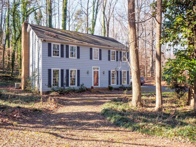 colonial-style house featuring central AC