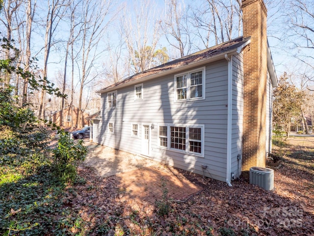 back of property with a patio and central AC unit