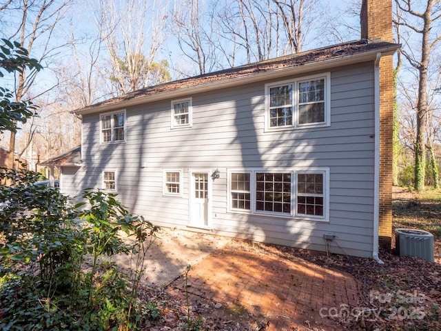 back of house featuring a patio and cooling unit