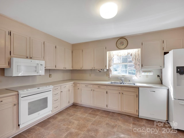 kitchen featuring white appliances and sink