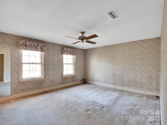 unfurnished room with carpet floors and ceiling fan