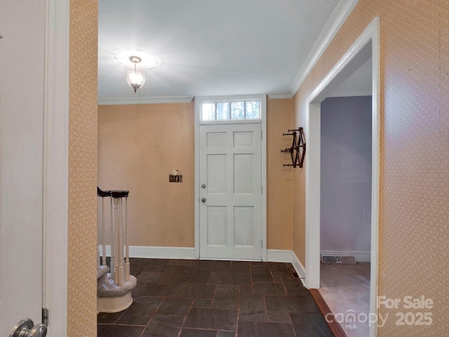 entrance foyer featuring crown molding