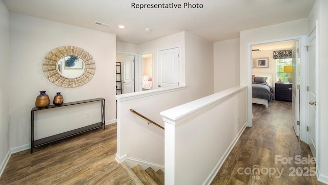 hallway featuring dark hardwood / wood-style flooring