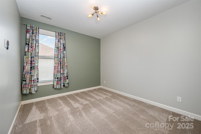 empty room featuring carpet floors