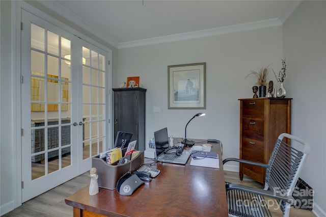 office area featuring french doors, light hardwood / wood-style flooring, and crown molding