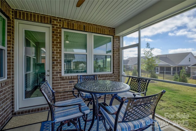 sunroom / solarium with ceiling fan