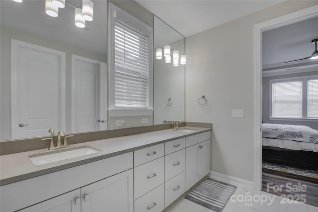 bathroom with tile patterned flooring and vanity