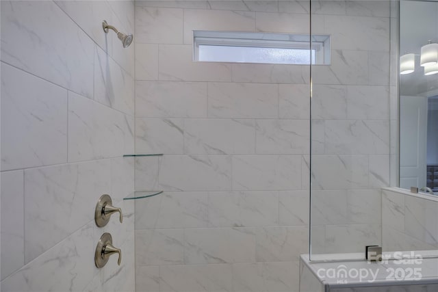 bathroom with tiled shower