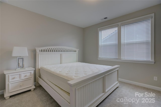 bedroom with light carpet