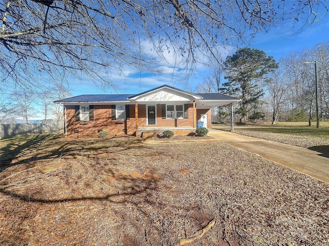 ranch-style home featuring a carport