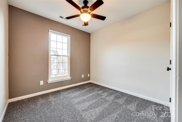 carpeted spare room with ceiling fan