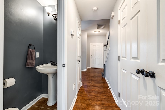 bathroom featuring hardwood / wood-style flooring and sink