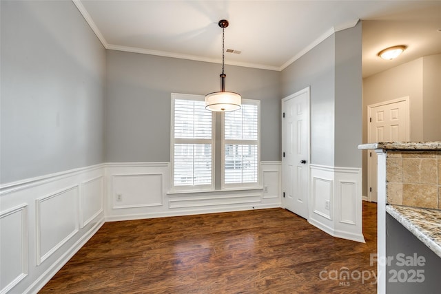 unfurnished dining area with crown molding and dark wood-type flooring