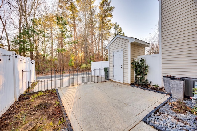 view of patio with a storage unit