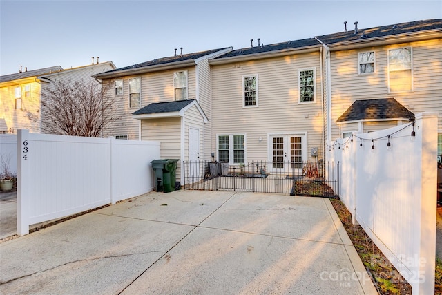 rear view of property featuring a patio area