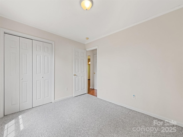 unfurnished bedroom featuring carpet and a closet