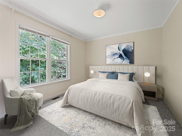 bedroom with crown molding and carpet