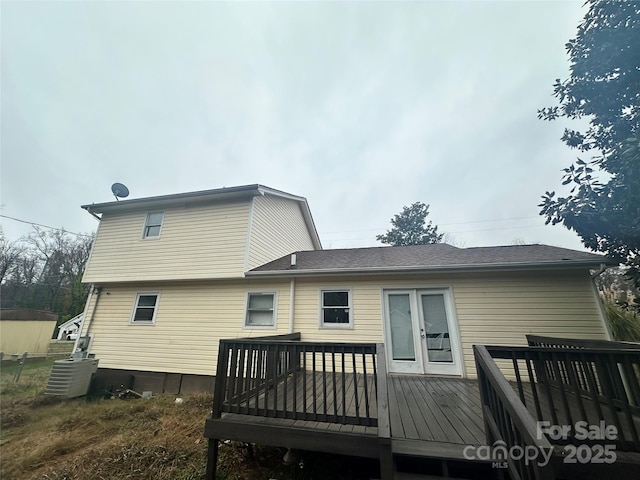 back of house featuring a wooden deck