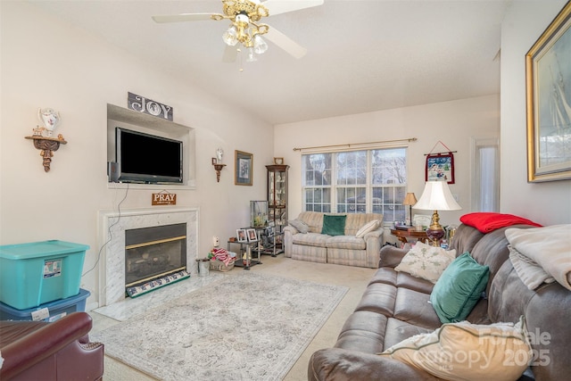 living room featuring ceiling fan and a premium fireplace