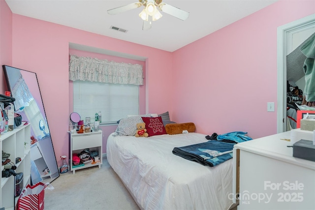 carpeted bedroom with ceiling fan