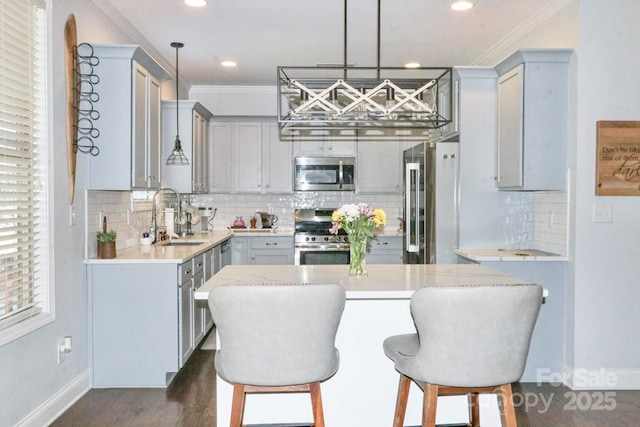 kitchen with sink, stainless steel appliances, and gray cabinetry