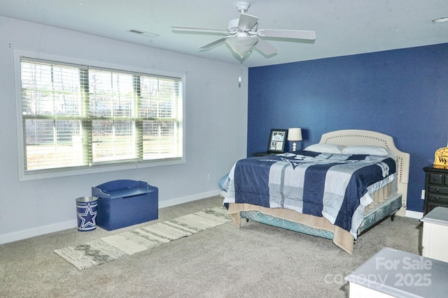 bedroom featuring ceiling fan and carpet