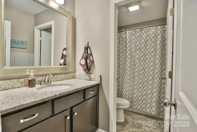 bathroom with toilet and vanity