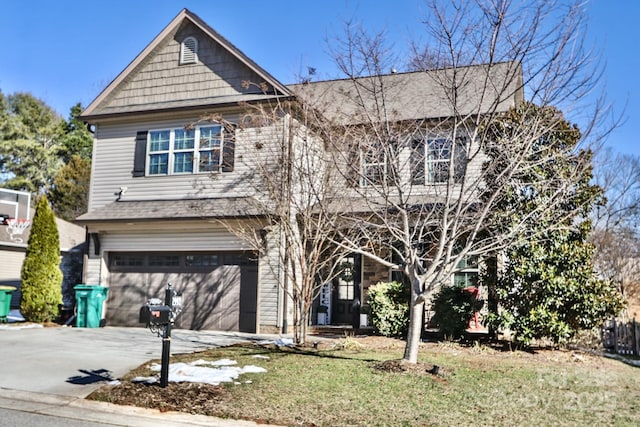 view of front facade featuring a front lawn and a garage